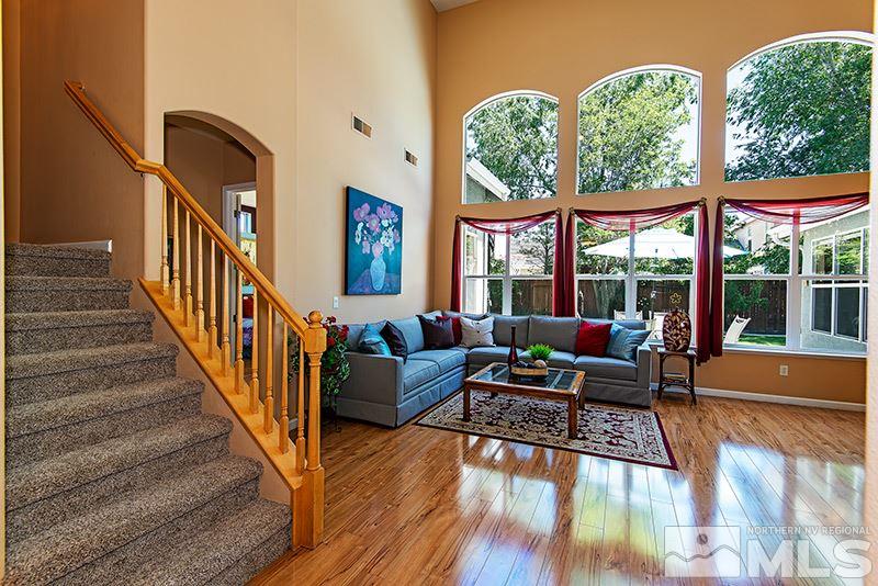 9628 Rolling Rock Way Reno, NV 89521 - Photo 7 of 23 a living room with furniture and a large window