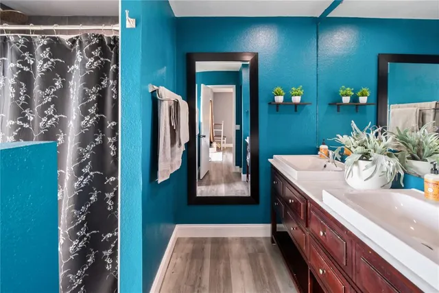 a bathroom with a sink and mirror