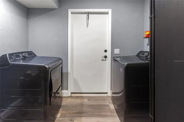 a utility room with dryer and washer
