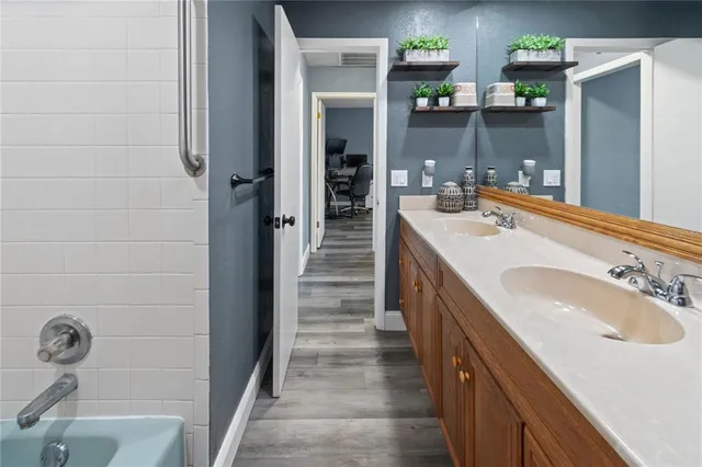 a bathroom with a sink and a mirror