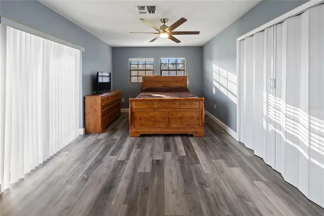a view of room with window and wooden floor