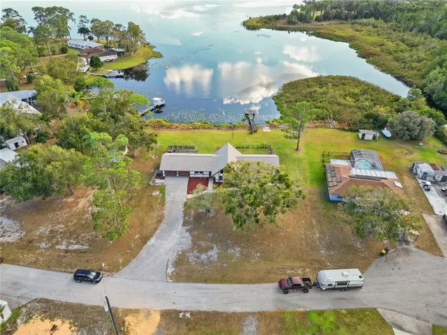 an aerial view of a house with outdoor space