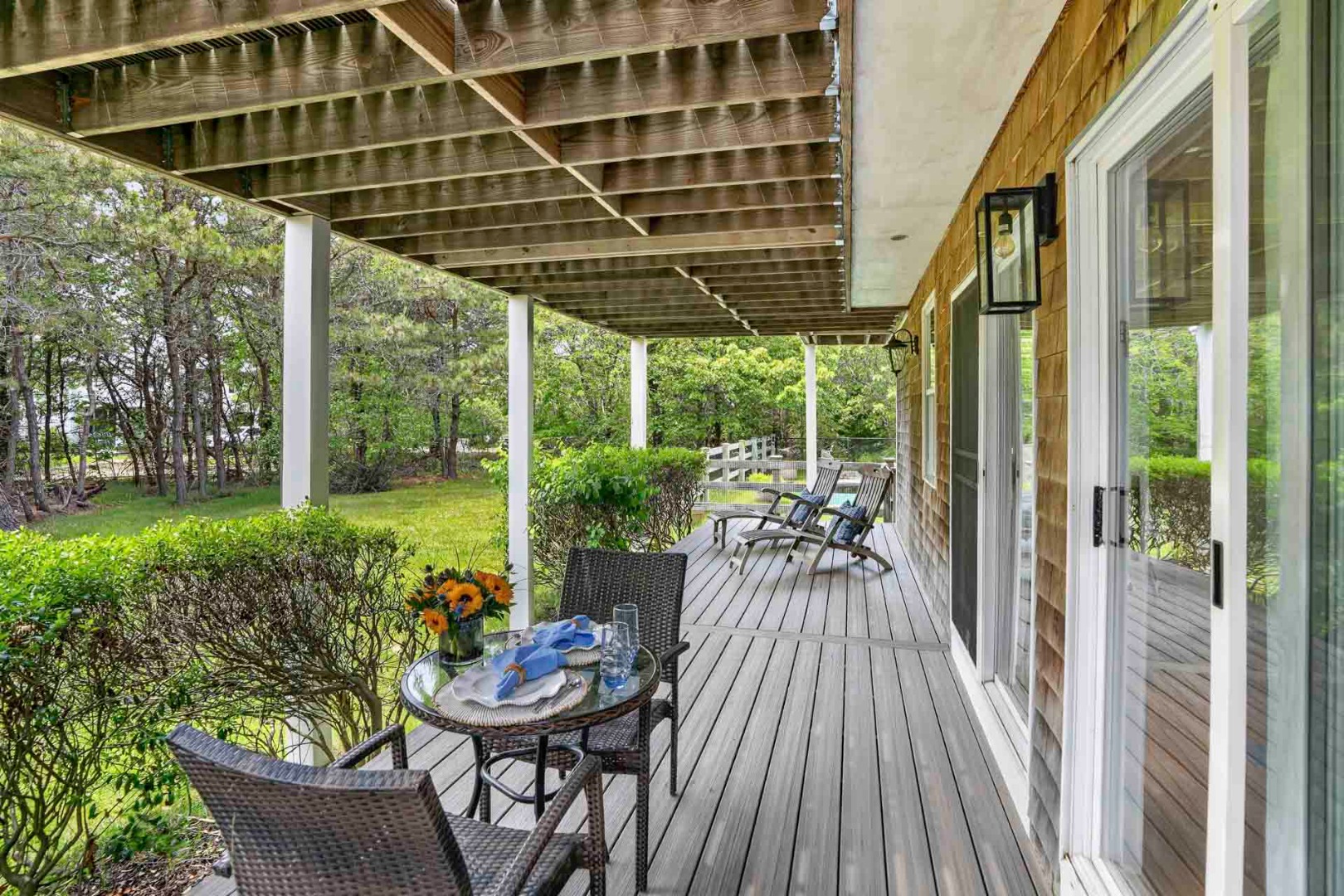9 Thaxter Lane Edgartown, MA 02539 - Photo 51 of 53 a view of a patio with table and chairs and potted plants