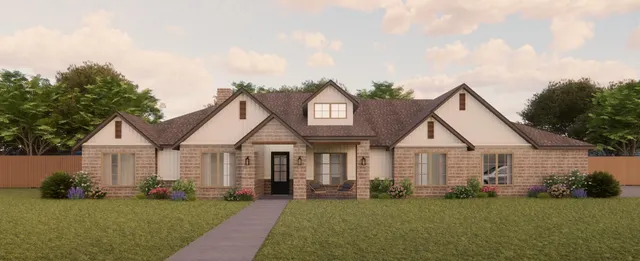 a front view of a house with a garden and yard