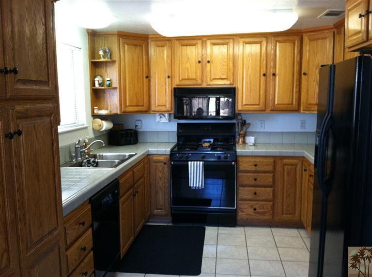 45472 Yale Street Indio, CA 92201 - Photo 2 of 23 a kitchen with stainless steel appliances granite countertop a stove and a refrigerator