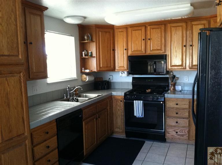 45472 Yale Street Indio, CA 92201 - Photo 3 of 23 a kitchen with a sink stove and microwave