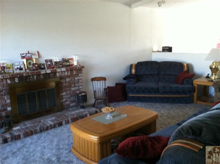 45472 Yale Street Indio, CA 92201 - Photo 7 of 23 a living room with furniture and a fireplace