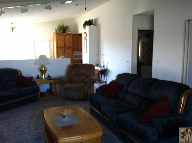45472 Yale Street Indio, CA 92201 - Photo 8 of 23 a living room with furniture and a rug