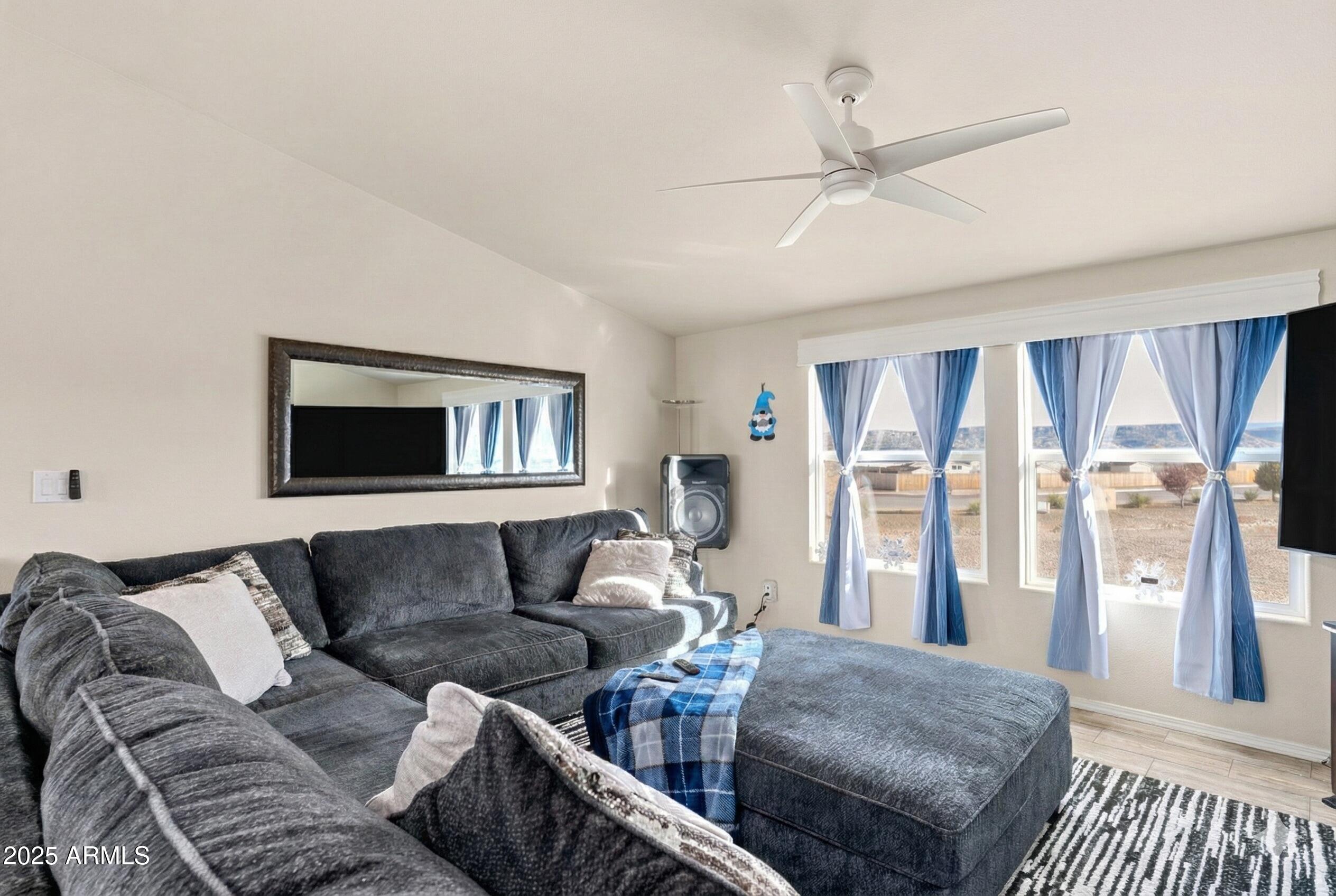 1033 Wheeler Road Camp Verde, AZ 86322 - Photo 5 of 51 a living room with furniture and a floor to ceiling window