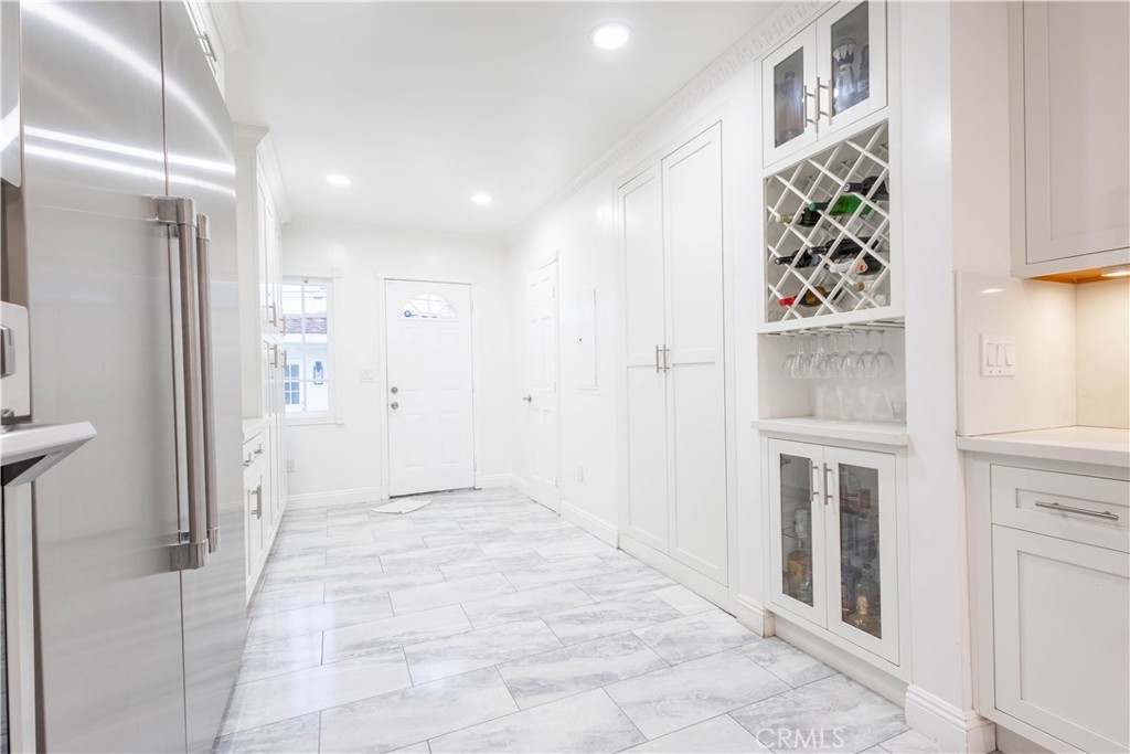 7847 Brookmill Road Downey, CA 90241 - Photo 17 of 71 a view of a hallway with wooden floor and staircase