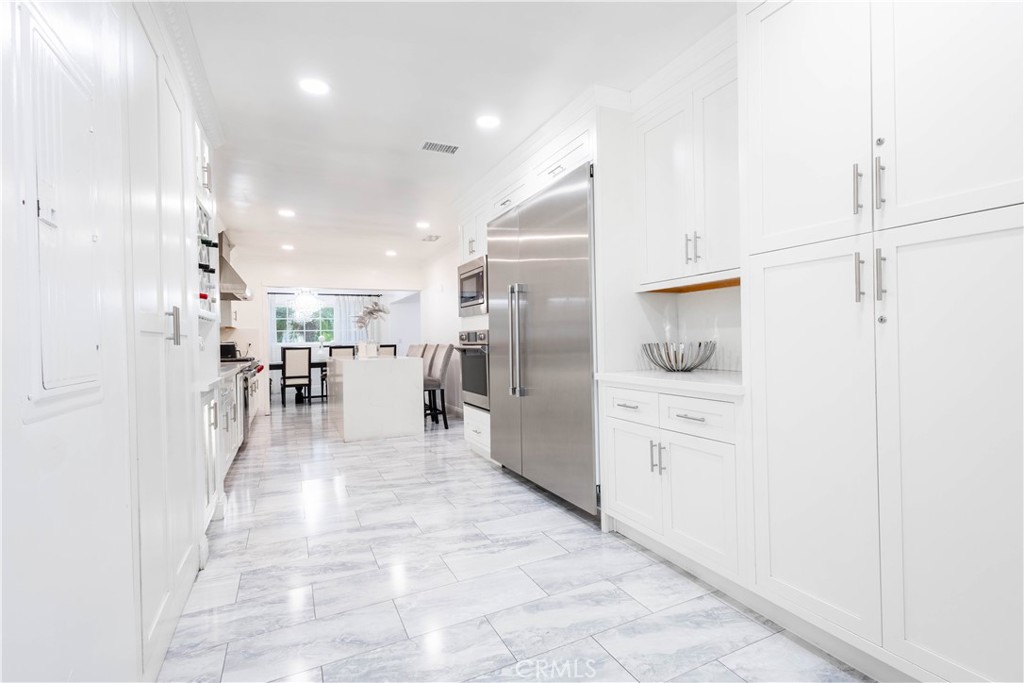 7847 Brookmill Road Downey, CA 90241 - Photo 23 of 71 a lobby with furniture and a wooden floor