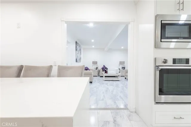 a bed room with furniture and painting on the wall