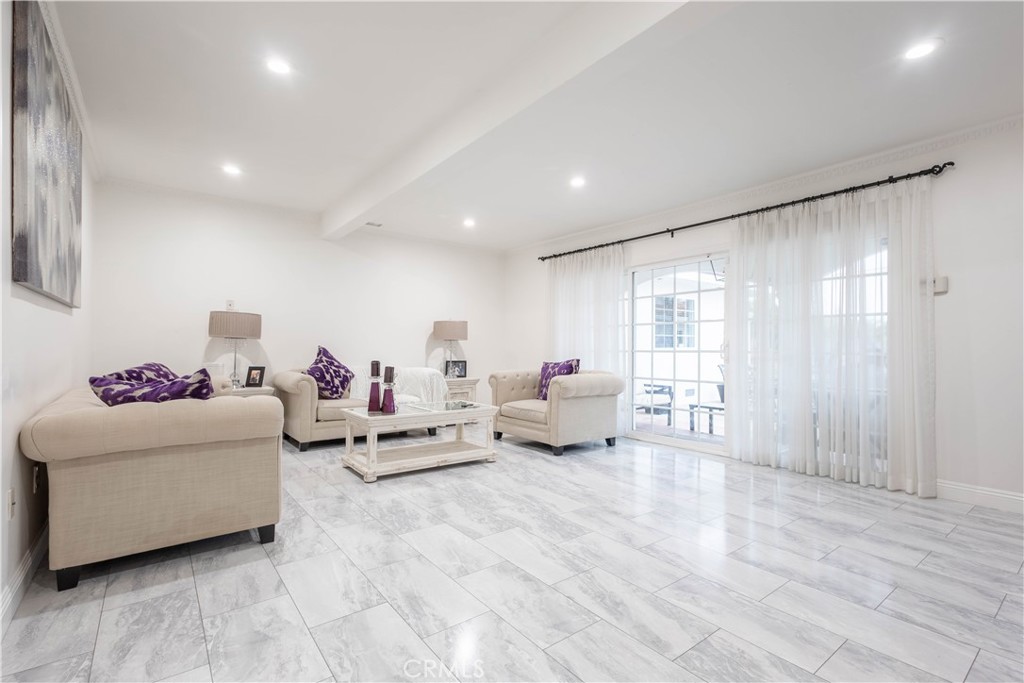 7847 Brookmill Road Downey, CA 90241 - Photo 25 of 71 a living room with furniture and a large window