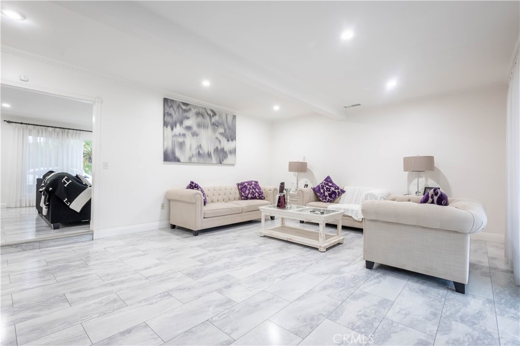 7847 Brookmill Road Downey, CA 90241 - Photo 26 of 71 a living room with furniture and a couch
