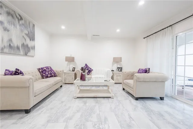 a bathroom with a toilet a sink and glass door