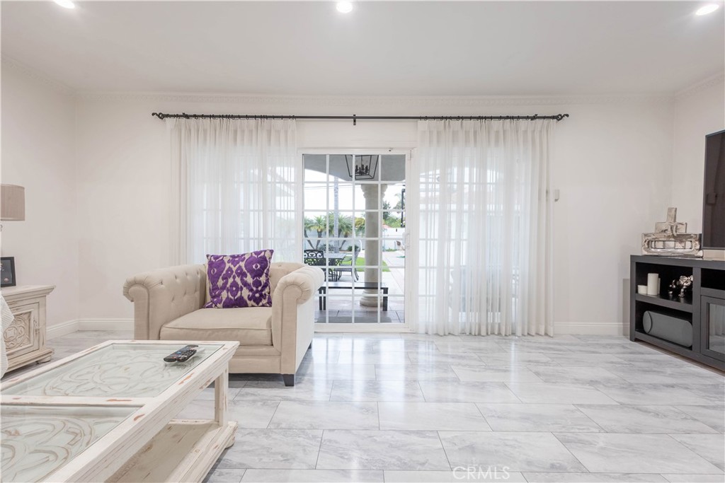 7847 Brookmill Road Downey, CA 90241 - Photo 29 of 71 a living room with furniture and a large window