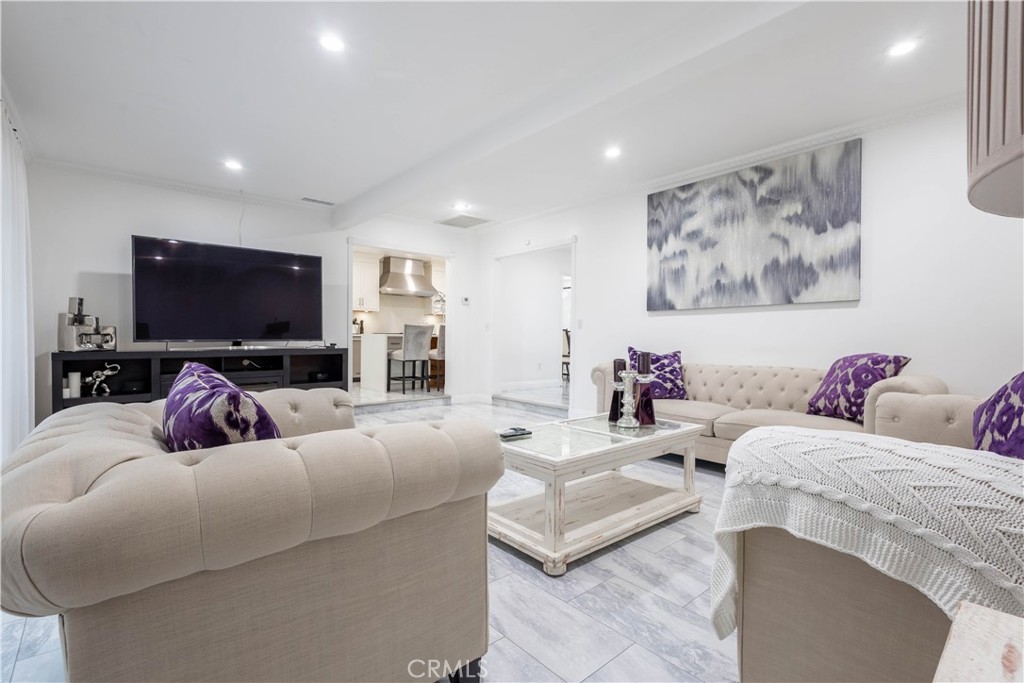 7847 Brookmill Road Downey, CA 90241 - Photo 30 of 71 a living room with furniture and a flat screen tv