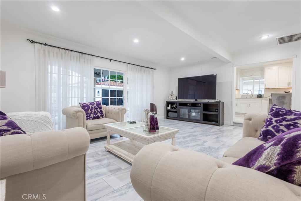 7847 Brookmill Road Downey, CA 90241 - Photo 31 of 71 a living room with furniture and a flat screen tv
