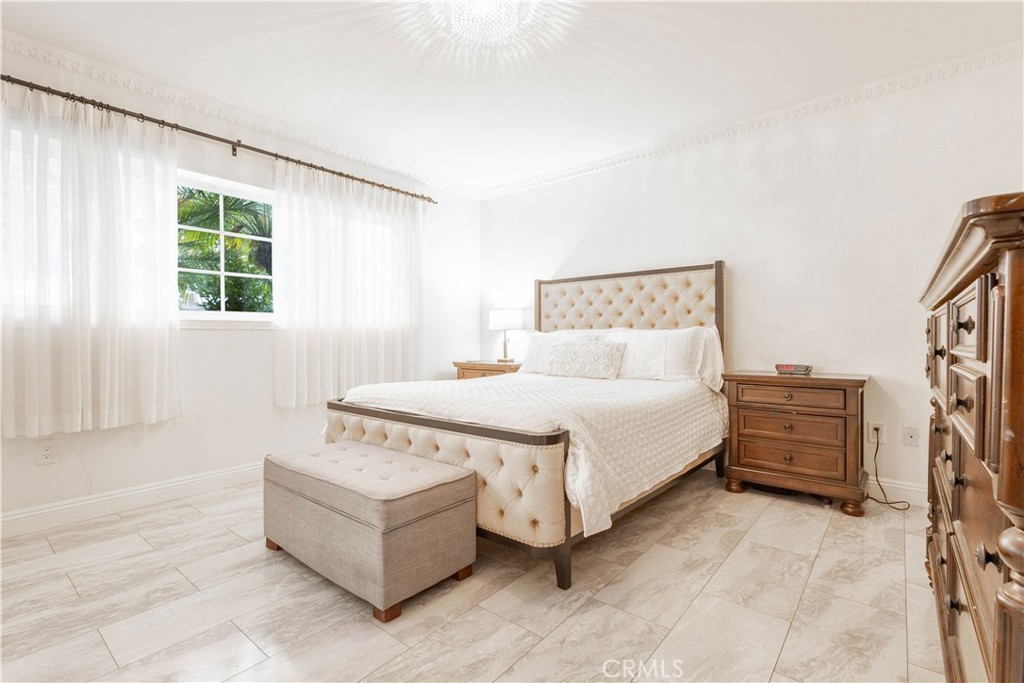 7847 Brookmill Road Downey, CA 90241 - Photo 33 of 71 a spacious bedroom with a bed and a couch