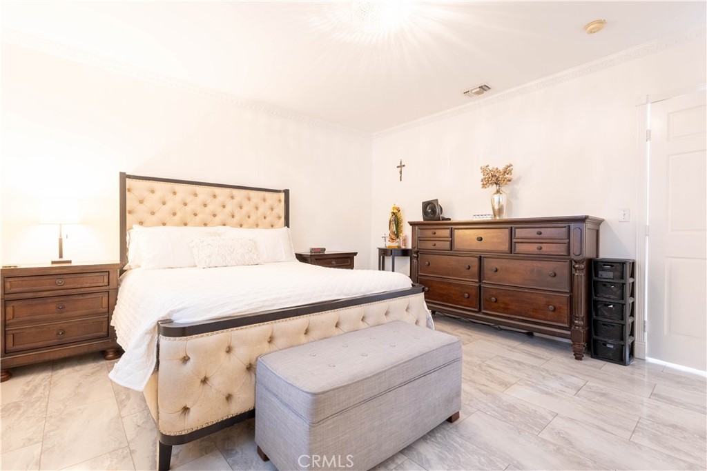 7847 Brookmill Road Downey, CA 90241 - Photo 34 of 71 a bed room with furniture and painting on the wall