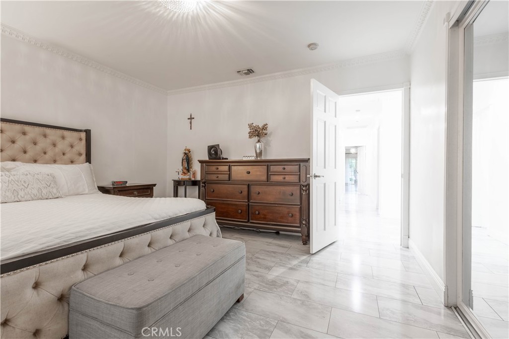 7847 Brookmill Road Downey, CA 90241 - Photo 35 of 71 a bedroom with a bed and a dresser