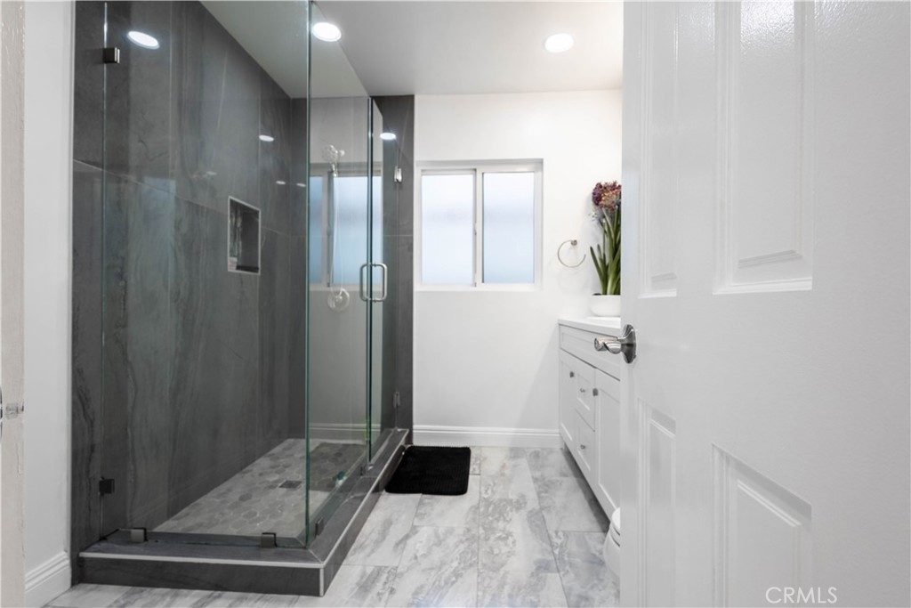 7847 Brookmill Road Downey, CA 90241 - Photo 38 of 71 a bathroom with a sink and a mirror