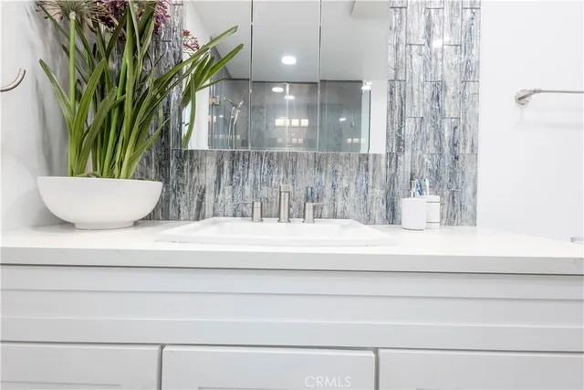 a bathroom with a sink and toilet