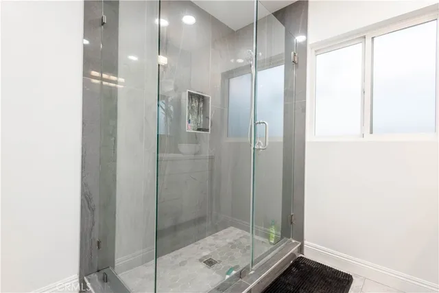 a white toilet sitting next to a window