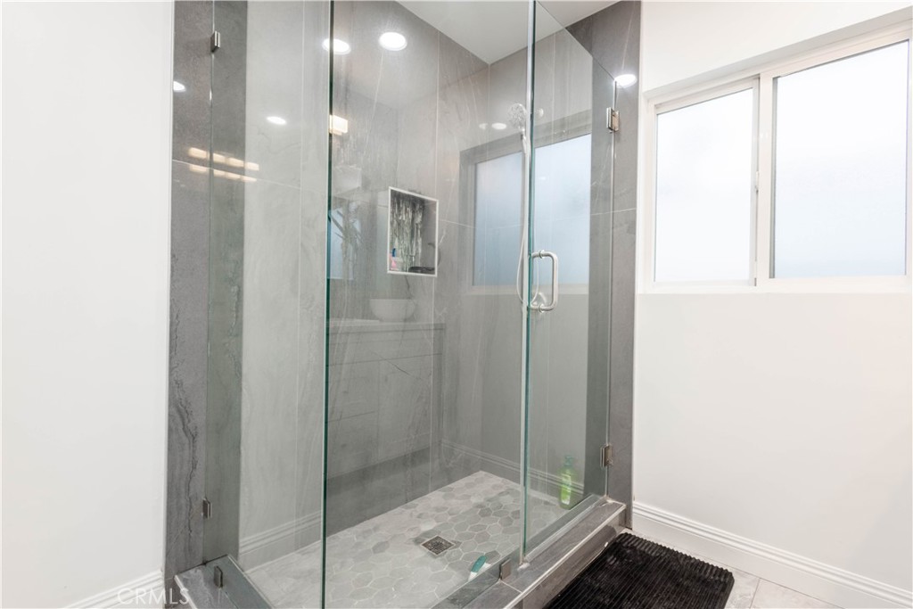 7847 Brookmill Road Downey, CA 90241 - Photo 42 of 71 a bathroom with a glass shower door