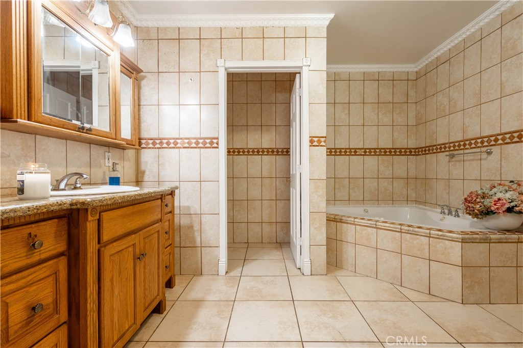 7847 Brookmill Road Downey, CA 90241 - Photo 46 of 71 a bathroom with a sink a toilet and shower