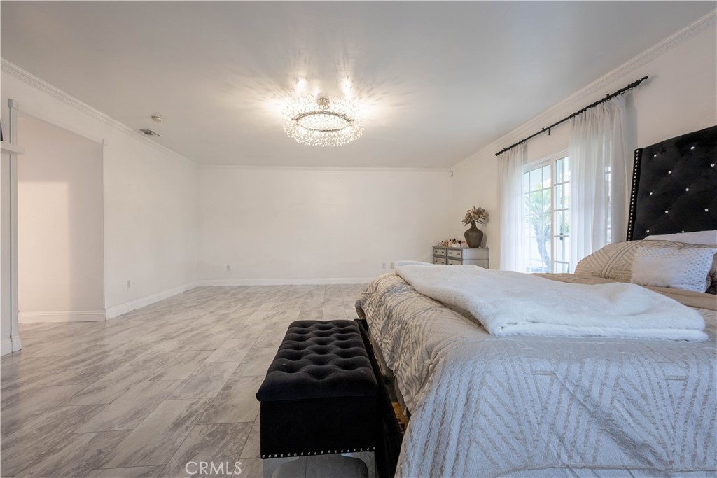 7847 Brookmill Road Downey, CA 90241 - Photo 55 of 71 a bedroom with a bed and a night stand