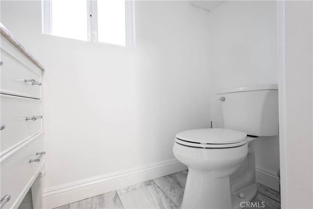 7847 Brookmill Road Downey, CA 90241 - Photo 56 of 71 a bathroom with a sink and toilet