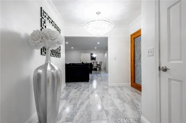 a large white kitchen with cabinets a sink a stove and white cabinets