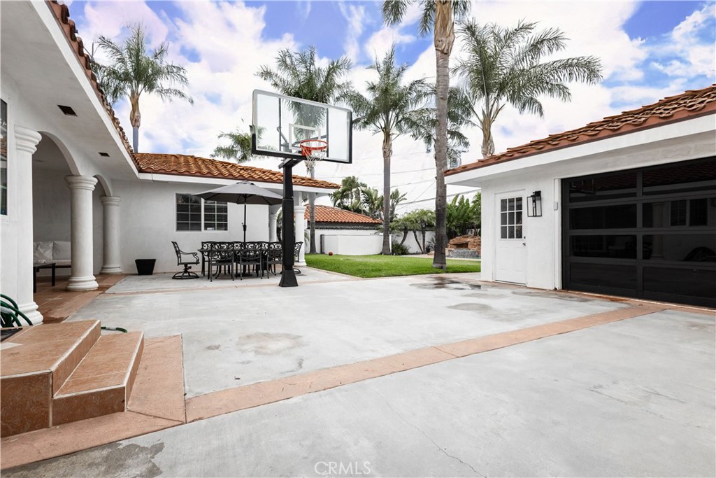 7847 Brookmill Road Downey, CA 90241 - Photo 61 of 71 a house with palm tree in front of it