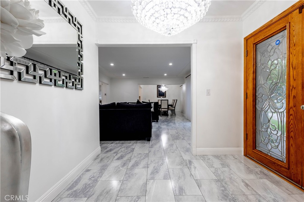 7847 Brookmill Road Downey, CA 90241 - Photo 7 of 71 a view of a hallway with wooden floor and staircase