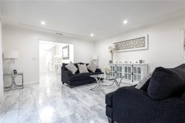 a kitchen with stainless steel appliances granite countertop a sink and a refrigerator