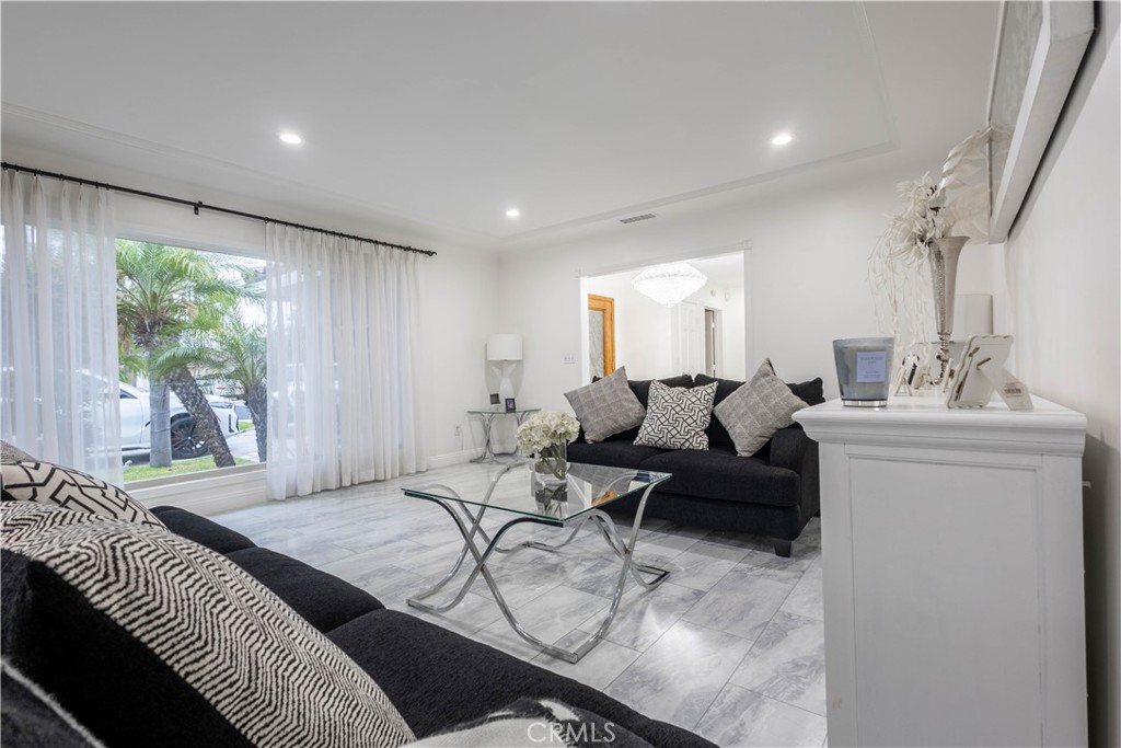 7847 Brookmill Road Downey, CA 90241 - Photo 10 of 71 a living room with furniture and a large window