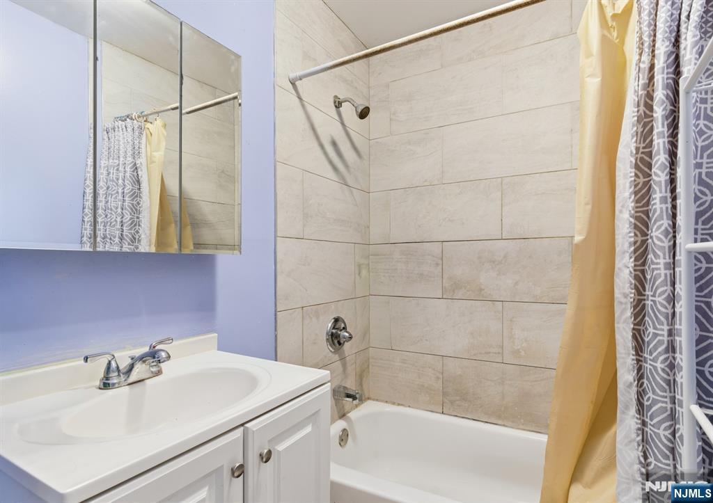 29 6th Avenue Newark, NJ 07104 - Photo 11 of 21 a bathroom with a sink and a bathtub