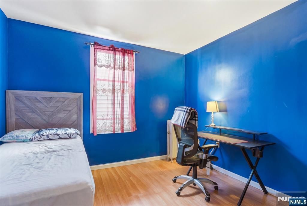 29 6th Avenue Newark, NJ 07104 - Photo 12 of 21 a bedroom with a bed and a window