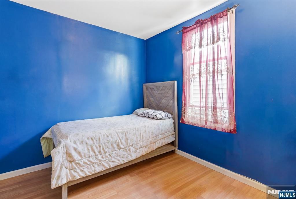 29 6th Avenue Newark, NJ 07104 - Photo 13 of 21 a bedroom with a bed and window