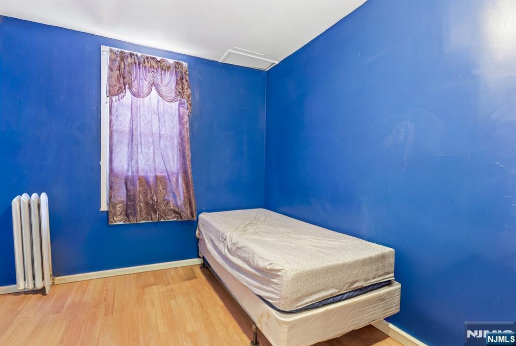 29 6th Avenue Newark, NJ 07104 - Photo 14 of 21 a bedroom with a bed and a window