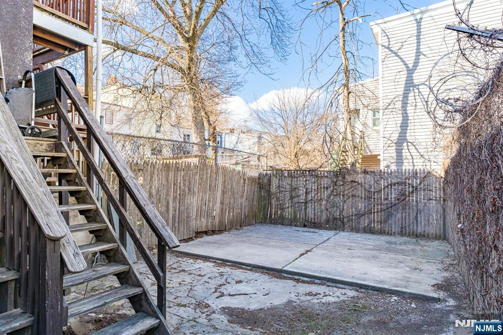29 6th Avenue Newark, NJ 07104 - Photo 19 of 21 a view of a yard with wooden fence