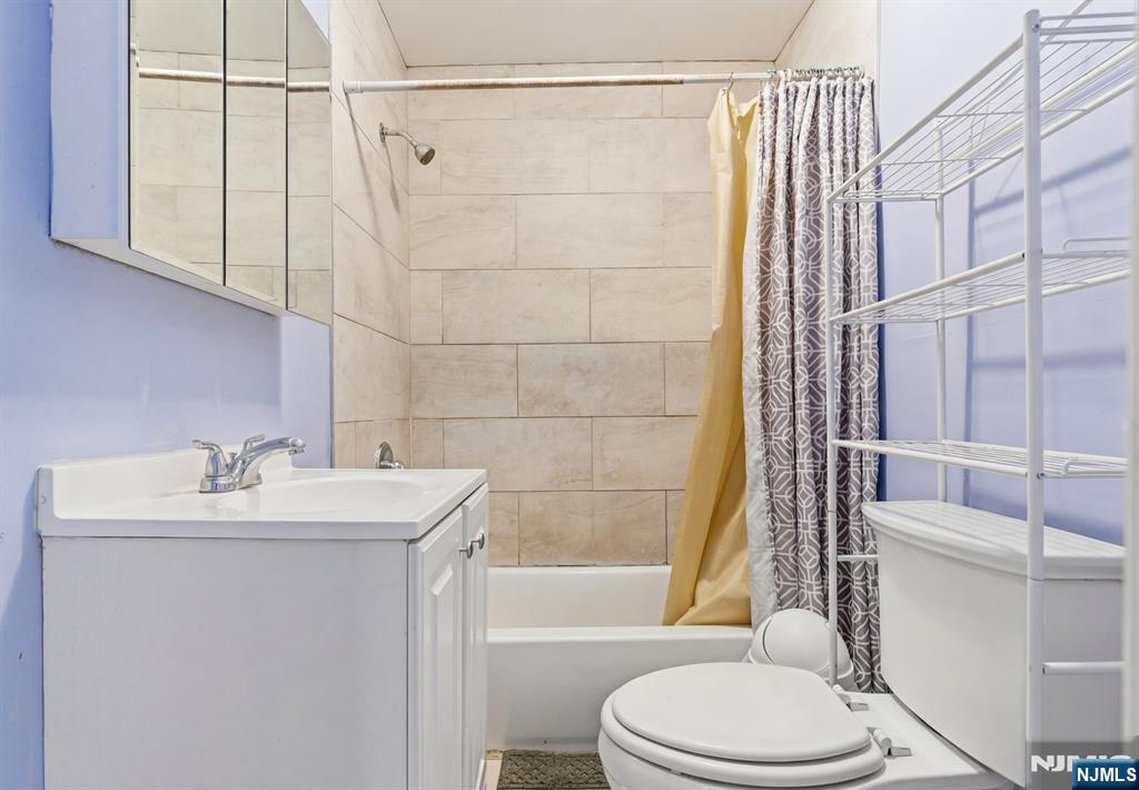 29 6th Avenue Newark, NJ 07104 - Photo 10 of 21 a bathroom with a sink toilet and shower