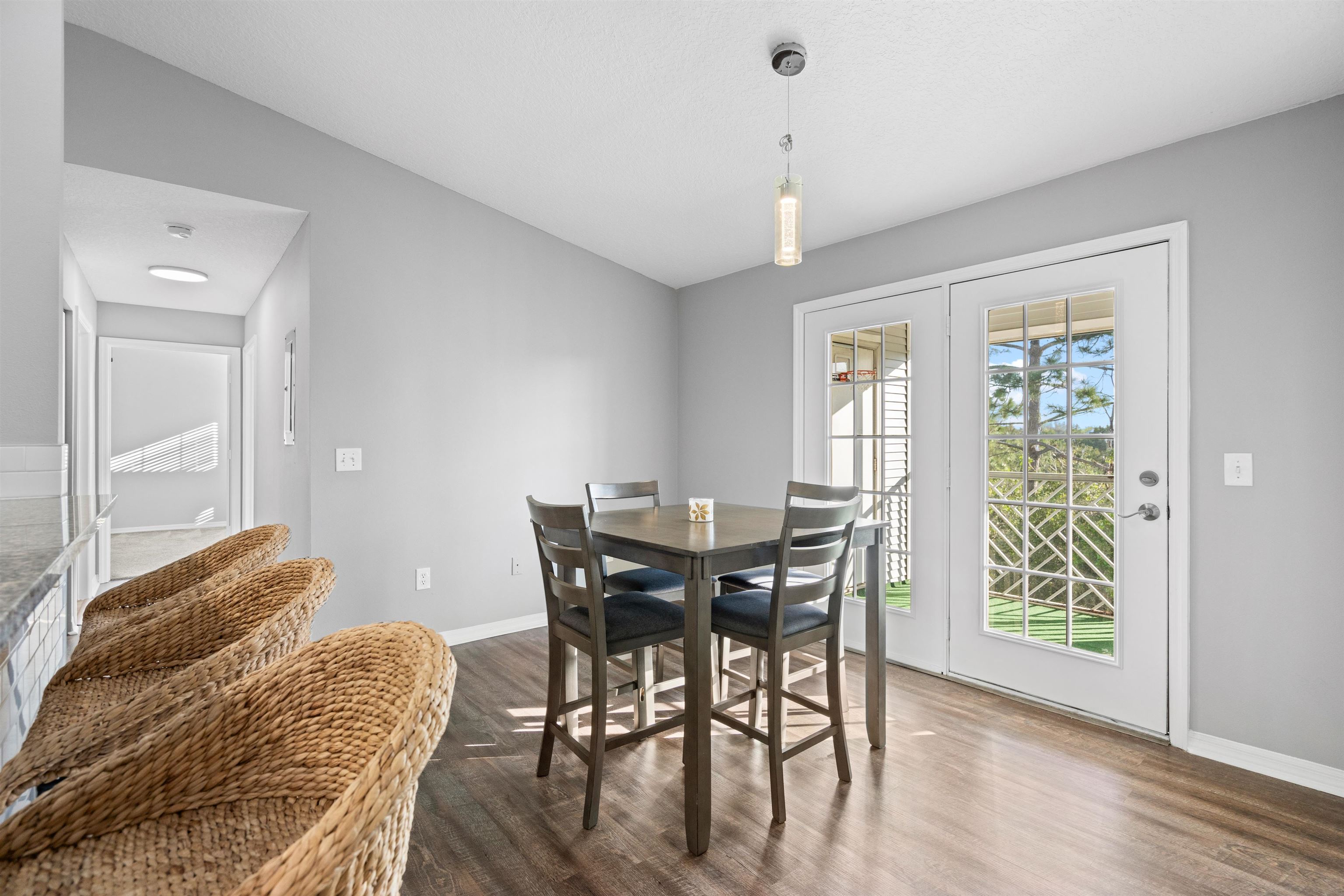 11207 Harbour Vista Circle, Unit 11207 St. Augustine, FL 32080 - Photo 16 of 42 a view of a dining room with furniture and wooden floor