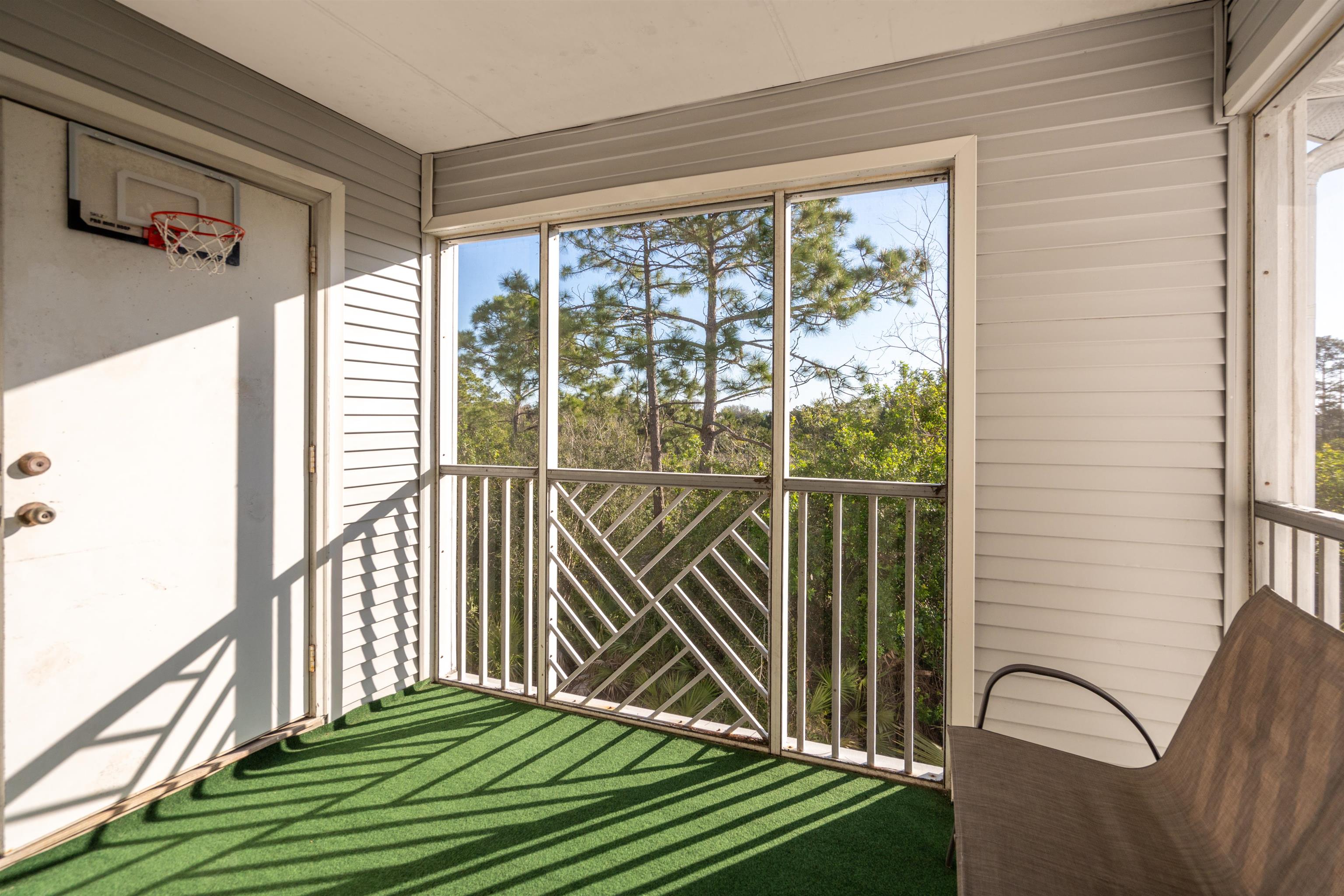 11207 Harbour Vista Circle, Unit 11207 St. Augustine, FL 32080 - Photo 19 of 42 a view of a balcony with floor to ceiling windows and stairs