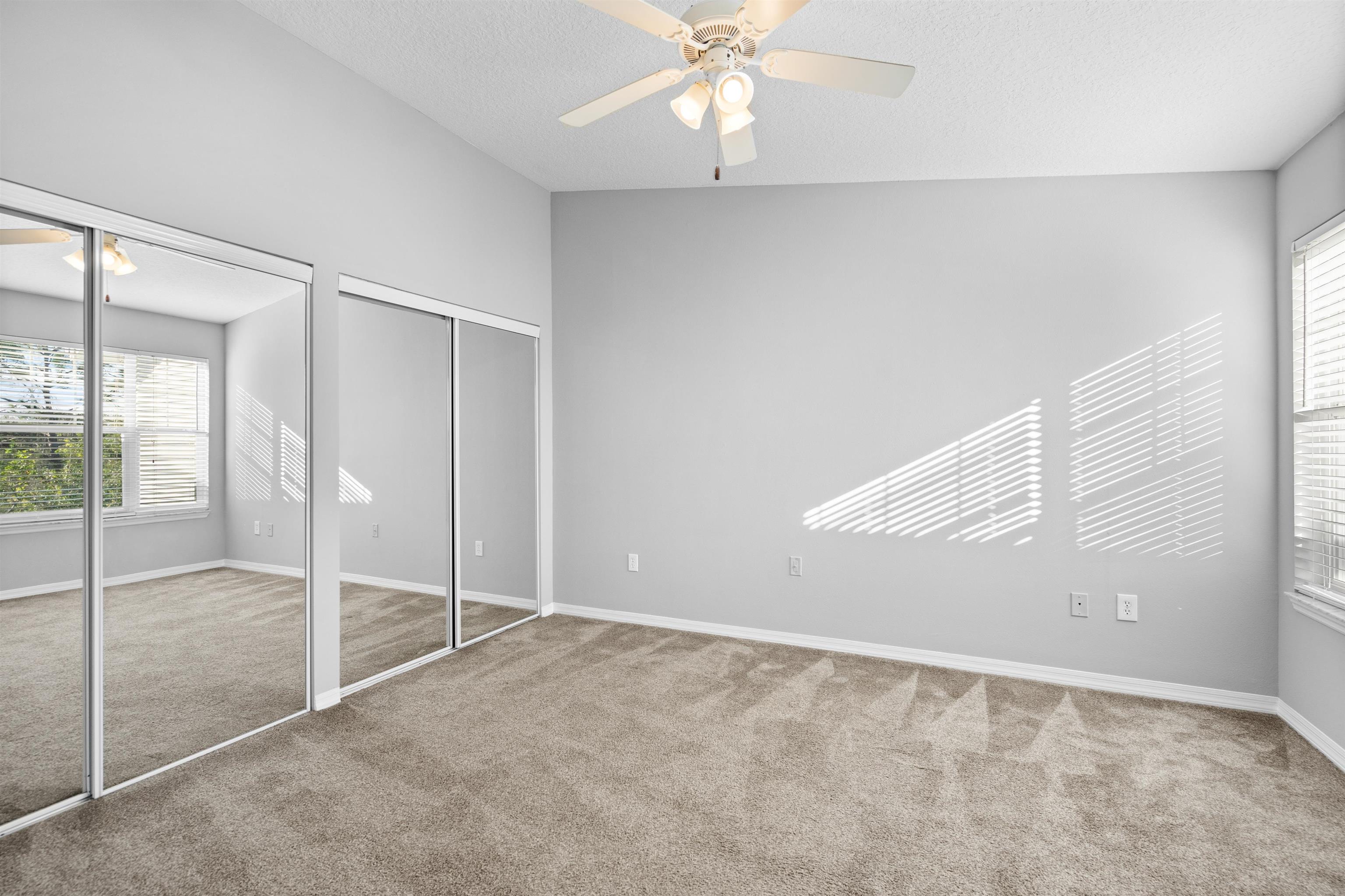 11207 Harbour Vista Circle, Unit 11207 St. Augustine, FL 32080 - Photo 24 of 42 an empty room with fan
