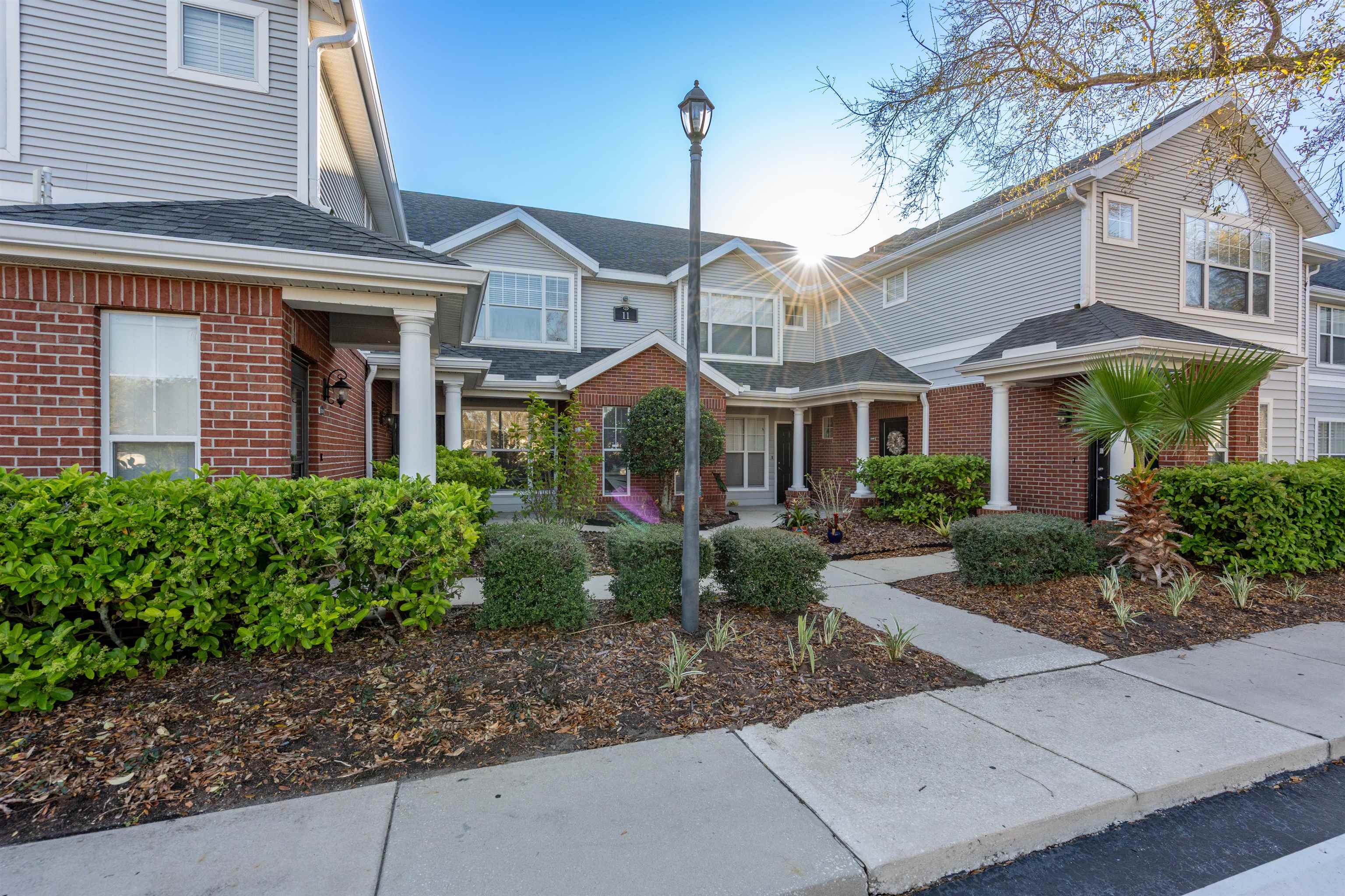 11207 Harbour Vista Circle, Unit 11207 St. Augustine, FL 32080 - Photo 42 of 42 a front view of a house with garden