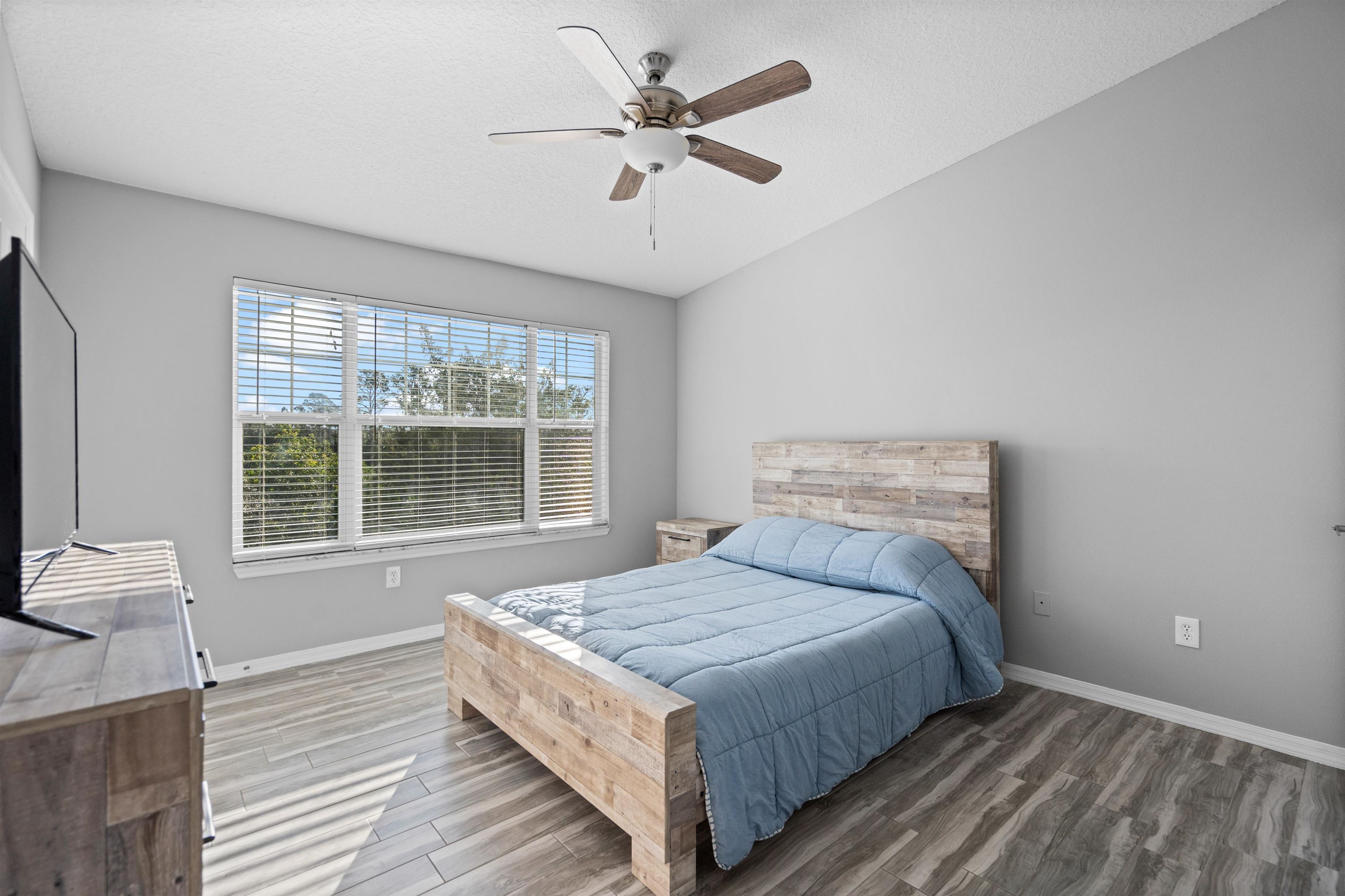 11207 Harbour Vista Circle, Unit 11207 St. Augustine, FL 32080 - Photo 9 of 42 a bedroom with a bed and a large window