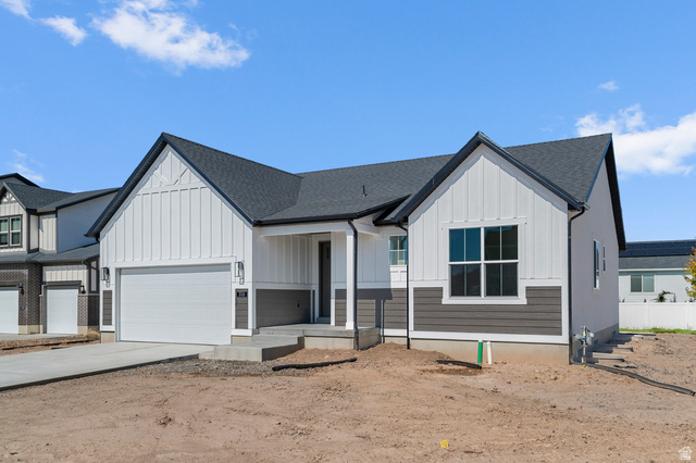 3016 West 2650 North Clinton, UT 84015 - Photo 3 of 20 Modern farmhouse featuring board and batten siding, a shingled roof, concrete driveway, covered porch, and an attached garage
