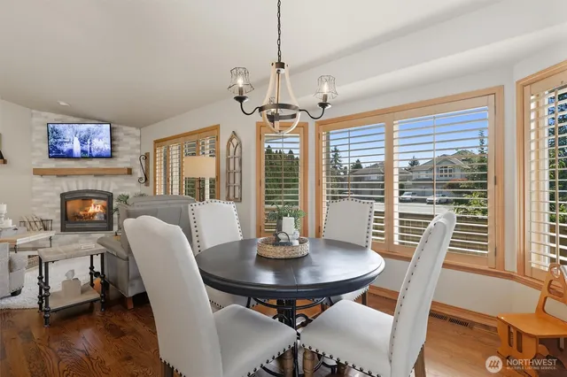 a view of a dining room with furniture window and wooden floor